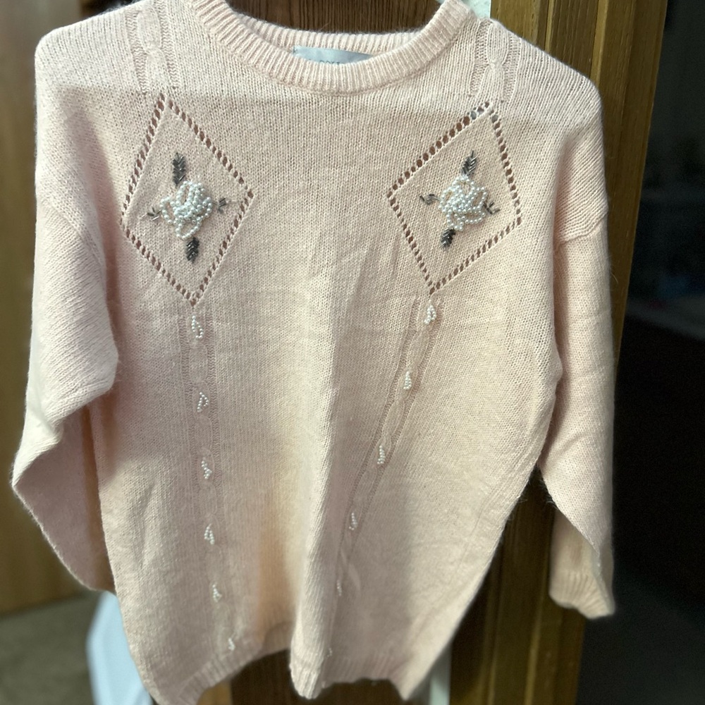 Women’s vintage sweater.Pretty pink color with beaded floral design.Rarely worn.